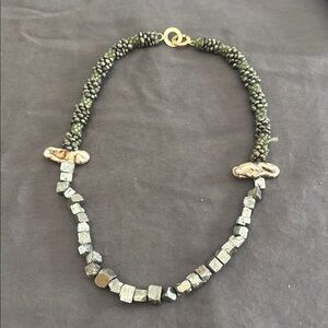 Bead and stone woven necklace.